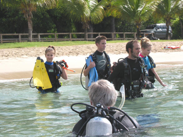 Young SCUBA divers getting ready for their first real dive!