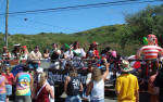 Pirates in Mardi Croix parade shooting water on spectators.
