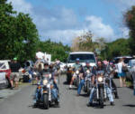 A group of motorcycles rumbling in the Mardi Croix parade.