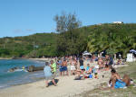 Partiers chilling out on Cane Bay Beach after Mardi Croix parade.