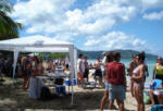 Vendors and visitors on Cane Bay Beach for Mardi Croix.